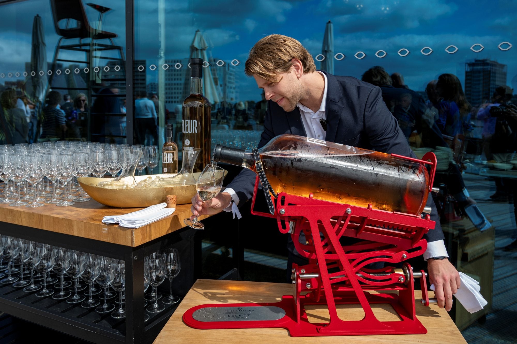 A sommelier pouring a large format from a MagnuMaster
